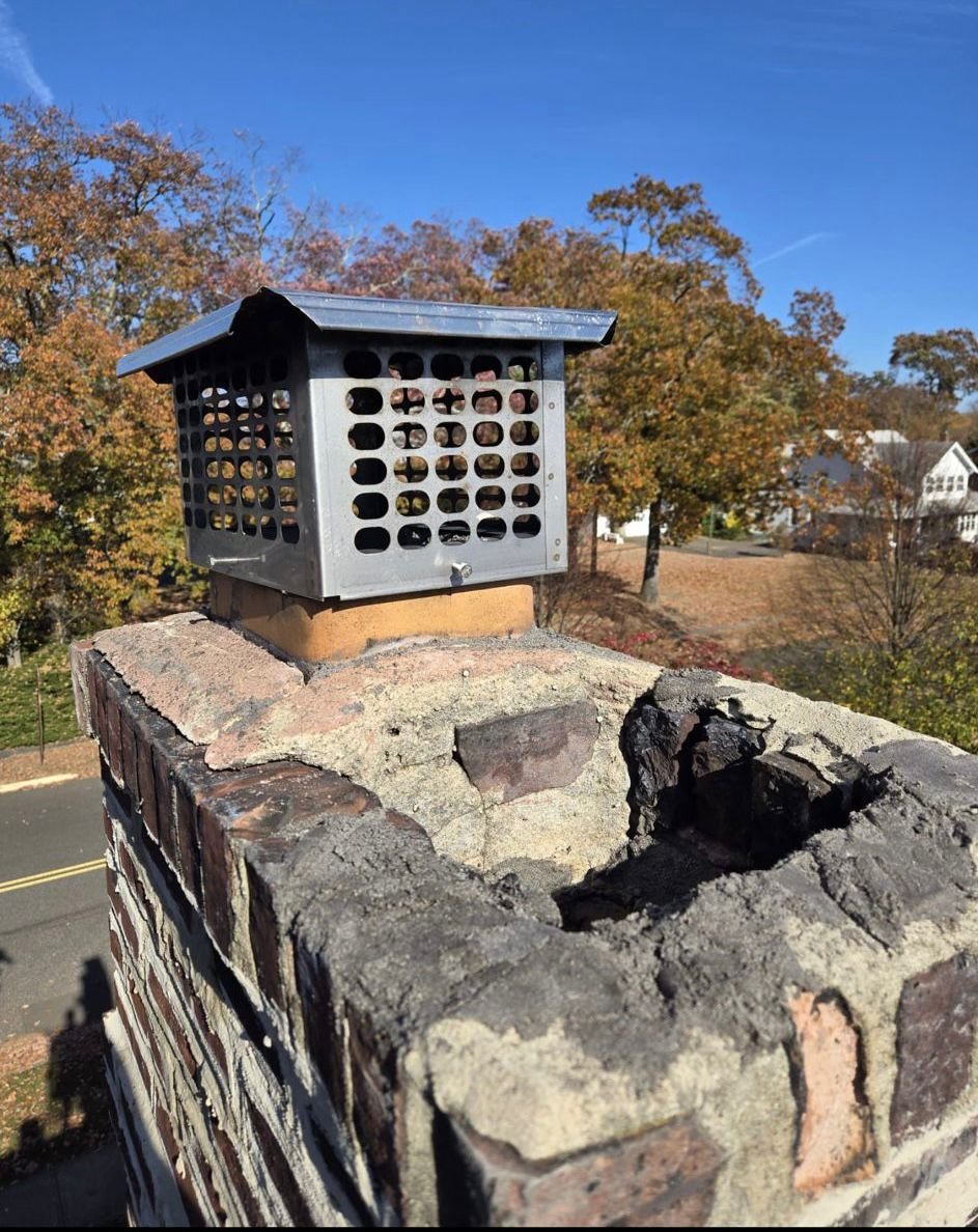 "Professional mason performing expert chimney brick repair and restoration."