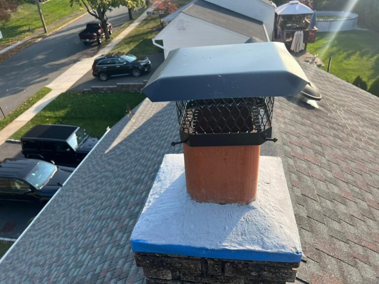 "A professional chimney sweep performing a thorough fireplace cleaning."
